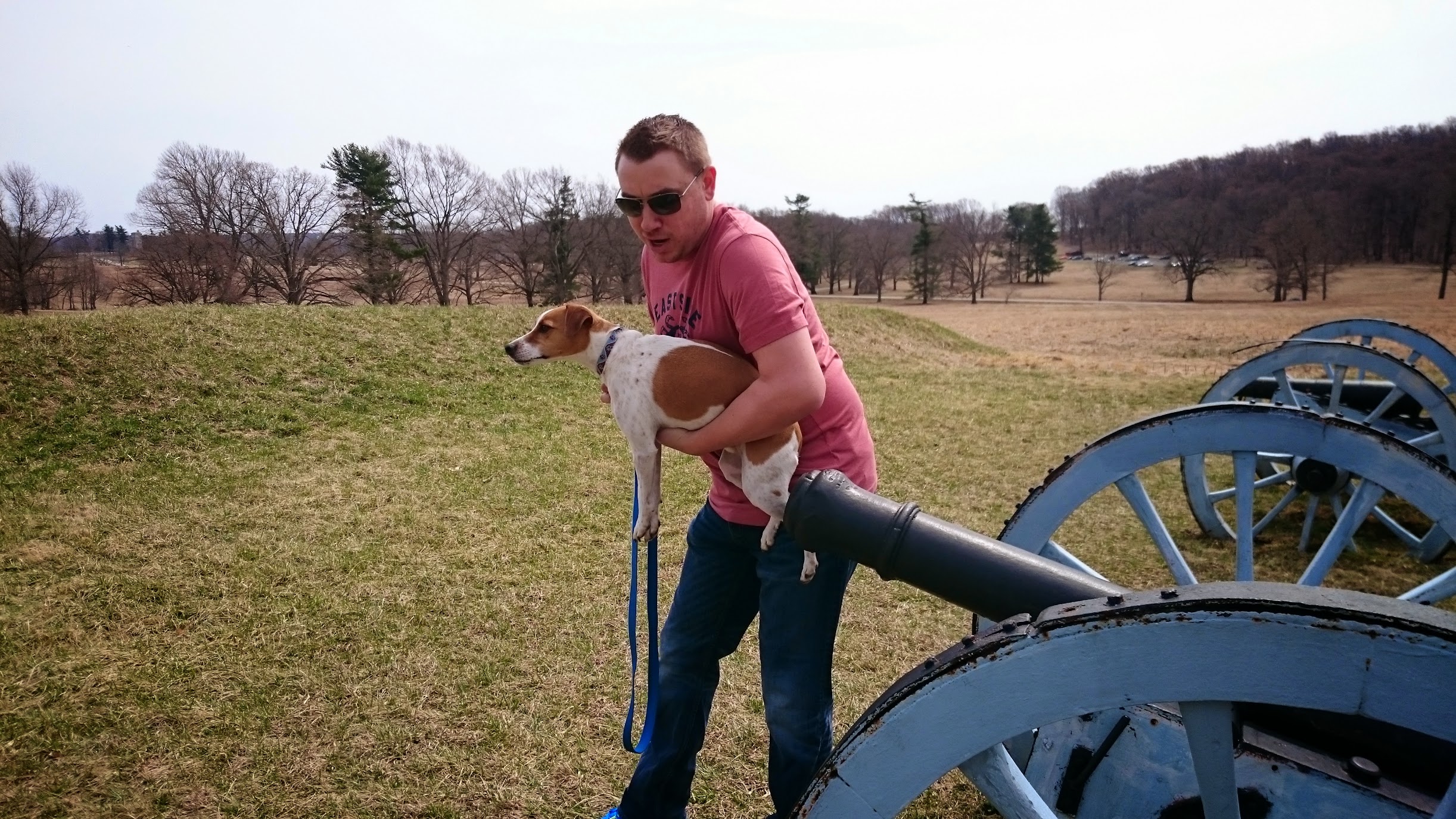 Eric holding Seymour next to a cannon at Gettysburg